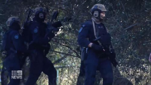 Manhunt underway after gun pointed at police in Sydney's west.