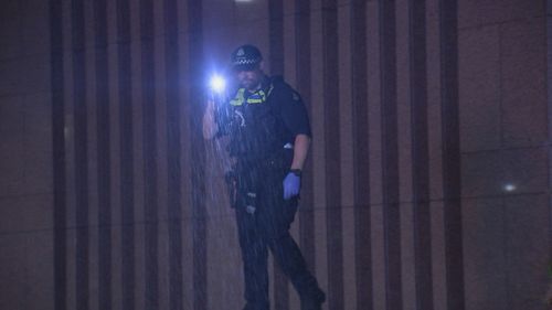 Police search Melbourne's Flinders Street Station after man allegedly stabbed. 