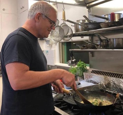 The PM at work on his "nyonya chicken curry".