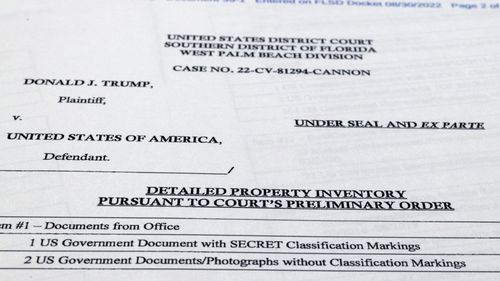 Pages from a FBI property list of items seized from former President Donald Trump's Mar-a-Lago estate and made public by the Department of Justice, are photographed Friday, Sept. 2, 2022. FBI agents who searched the home found empty folders marked with classified banners. The inventory reveals in general terms the contents of the 33 boxes taken during the Aug. 8 search. (AP Photo/Jon Elswick)