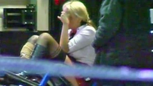 Zita Sukys is treated by paramedics after she was shot in the leg at the Melbourne nightclub.