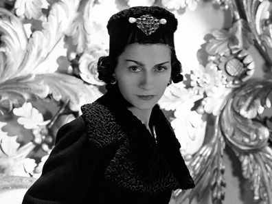 French fashion designer Coco Chanel in her apartment at the Hotel