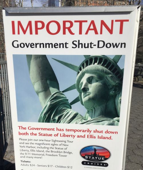 A sign at the Ellis Island ferry cue informed tourists of the shutdown's impact. (AAP)