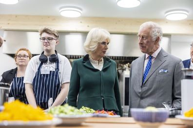 King Charles III, right and Queen Camilla visit Fare Share to launch the Coronation Food Project, on his birthday, in Didcot, England, Tuesday, Nov. 14, 2023.