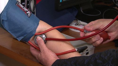 Person receiving blood pressure test, doctor, health, medical.