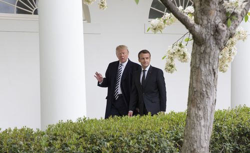 Mr Trump taking his French counterpart on a tour of the White House. (AAP)