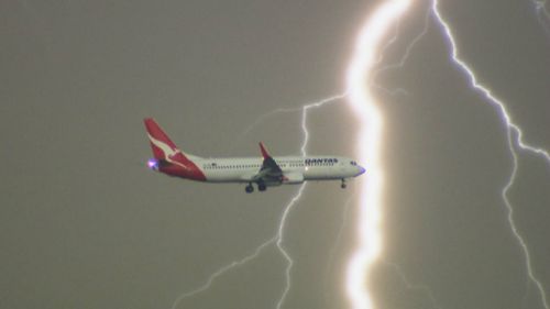 The lightning bolt strikes behind the plane. (Daniel Shaw)