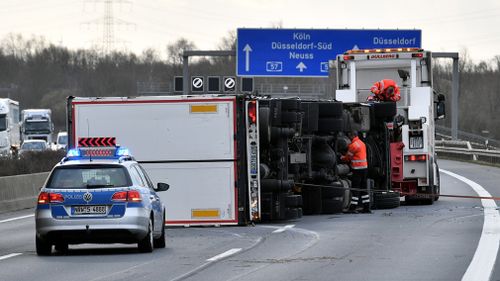  A truck is overturned by massive gusts near the motorway junction in Kaarst, Germany. (AAP)