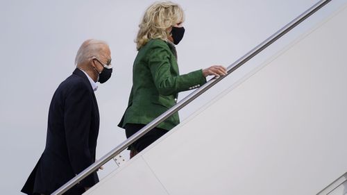 President Joe Biden and first lady Jill Biden board Air Force One at Andrews Air Force Base, Md., Friday, Feb. 26, 2021. They are en route to Houston to survey damage caused by severe winter weather and encourage people to get their coronavirus shots