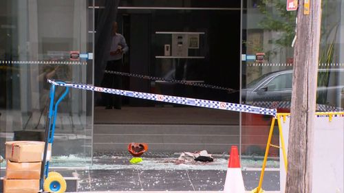 Two men have been injured after one fell through a glass ceiling at a Sydney construction site.