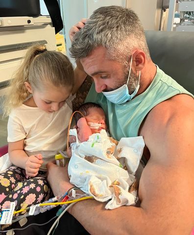 Baby Harrison with sister Lara and dad. 