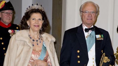 Queen Silvia of Sweden and King Carl Gustaf of Sweden arrive for an event.