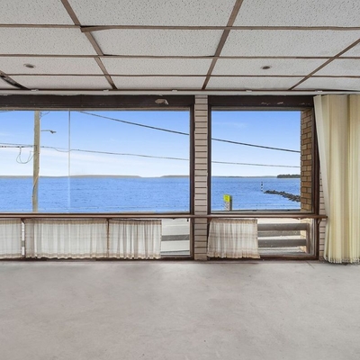 Vintage waterfront house shatters reserve by $1.6 million and doubles price in seven years