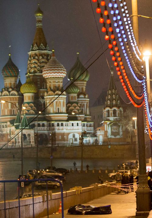 The body of Boris Nemtsov, a former Russian deputy prime minister and opposition leader lies at Red Square with St. Basil Cathedral in the background. (AAP)