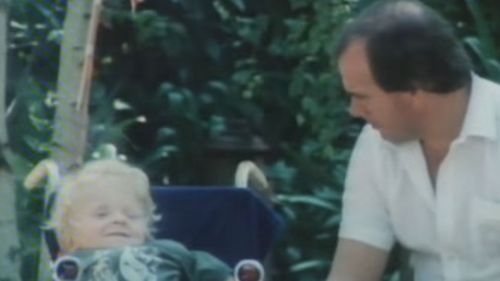 Quentin Kenihan as a child with journalist Mike Willesee.