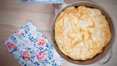 This is what perfect, crispy filo pastry on top of a spinach pie in a pan looks like