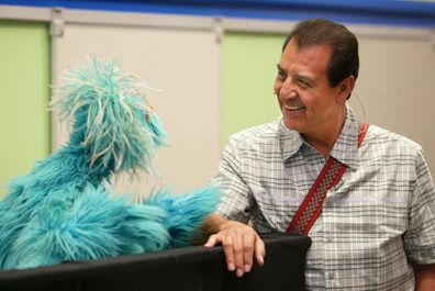 Sesame Street's Luis and Muppet Rosita chat in 2001.
