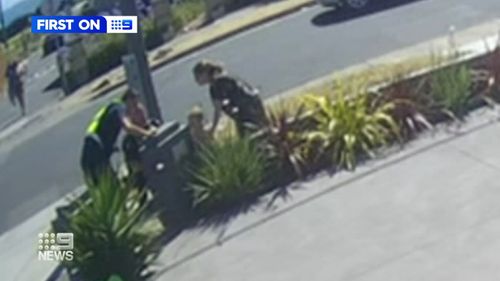 CCTV has captured the moment a toddler stumbled into the hands of rescuers after he was abandoned by a thief in Melbourne. 