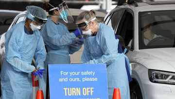 Staff prepare to collect samples at a drive-through COVID-19 testing clinic at Bondi Beach in Sydney, Australia.