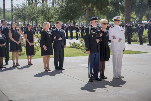 The family proceeded into the rotunda with military precision.