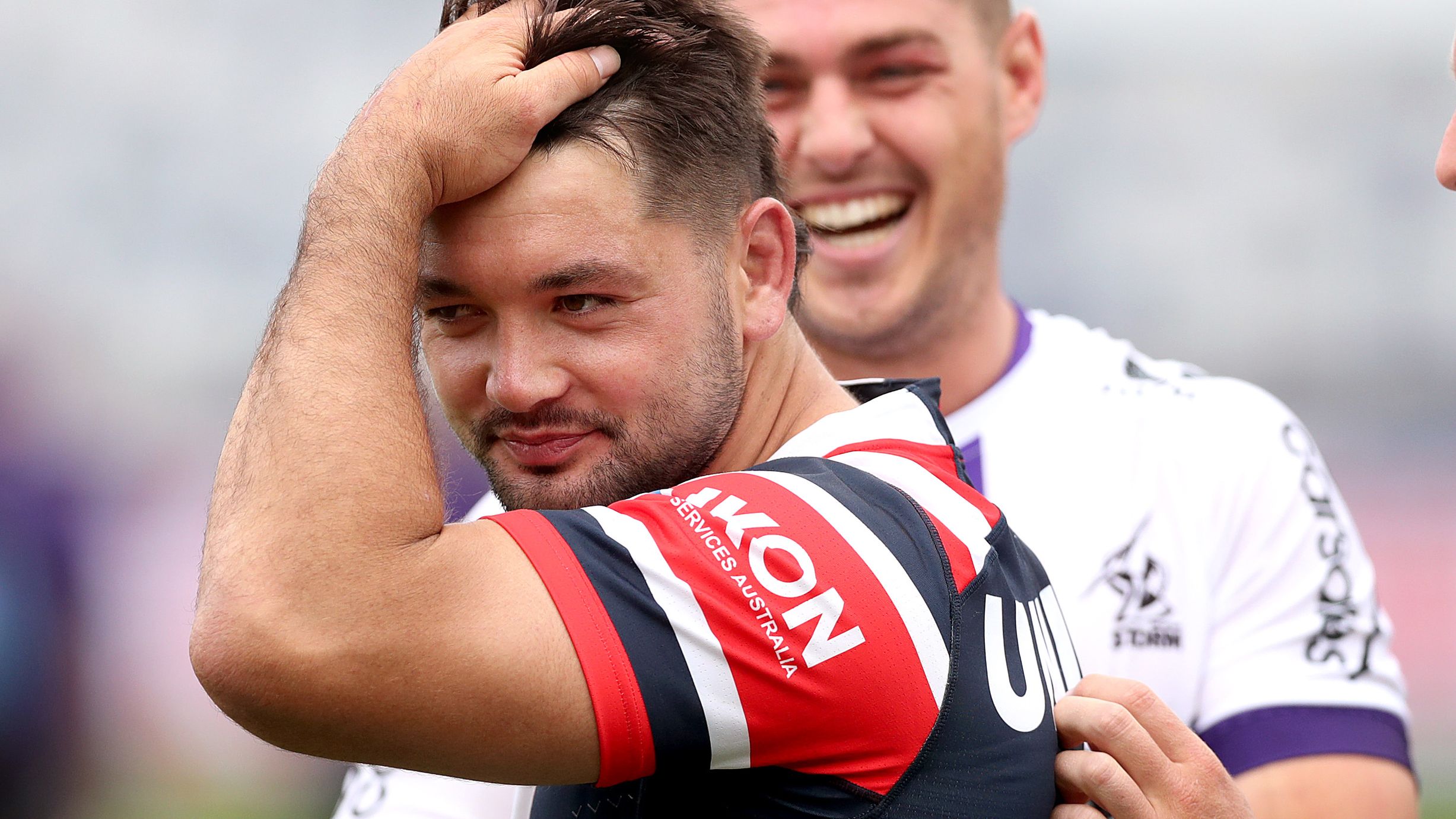  Brandon Smith of Roosters speaks to former Storm team mates during the NRL Trial match between Melbourne Storm and Sydney Roosters at GMHBA Stadium on February 12, 2023 in Geelong, Australia. (Photo by Kelly Defina/Getty Images)