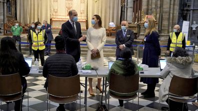 Prince William and Kate, Duchess of Cambridge speak to staff during a visit to the vaccination centre at Westminster Abbey, London, Tuesday, March 23, 2021 to pay tribute to the efforts of those involved in the Covid-19 vaccine rollout