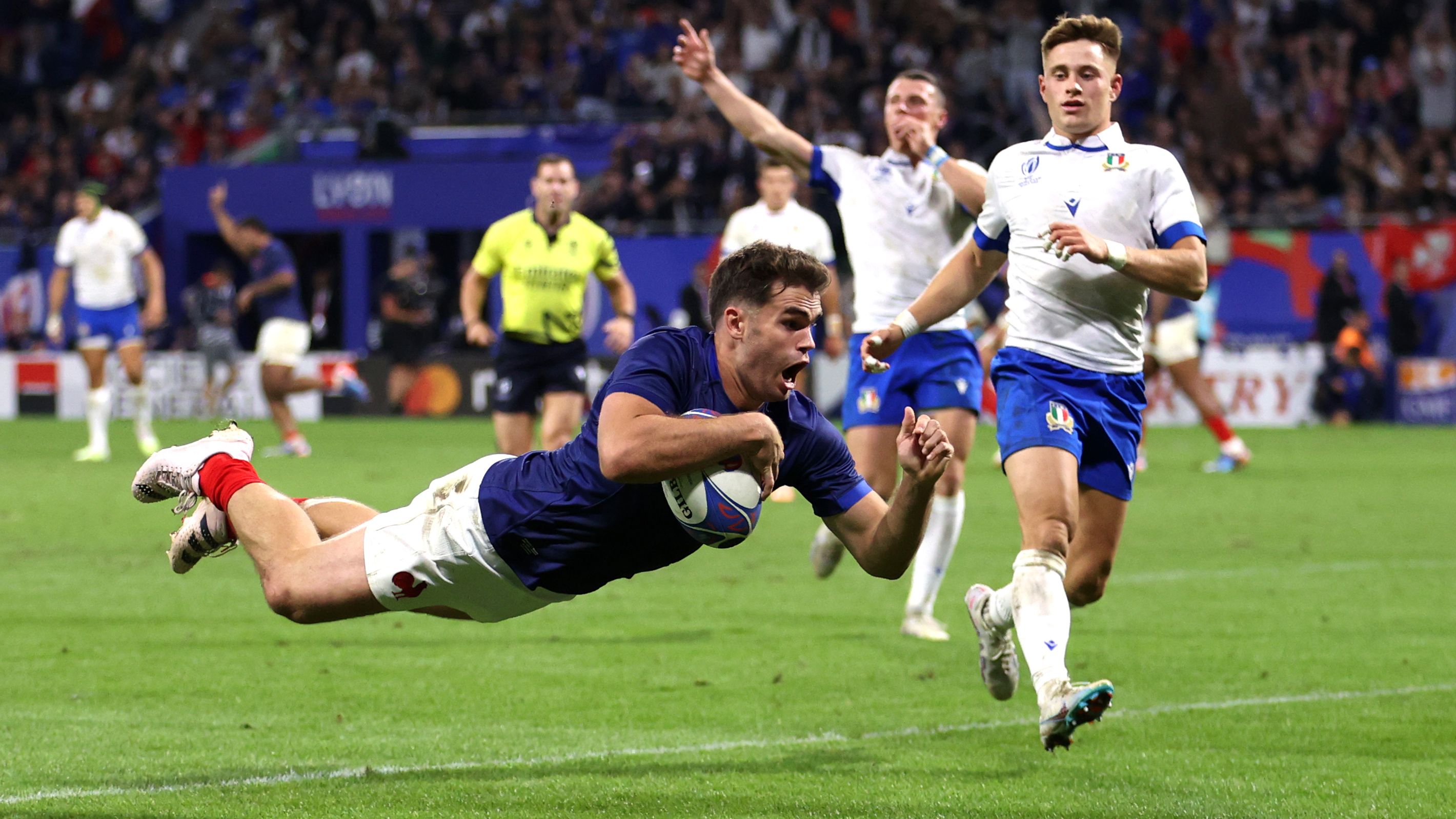Damian Penaud of France scores his team&#x27;s fourth try.