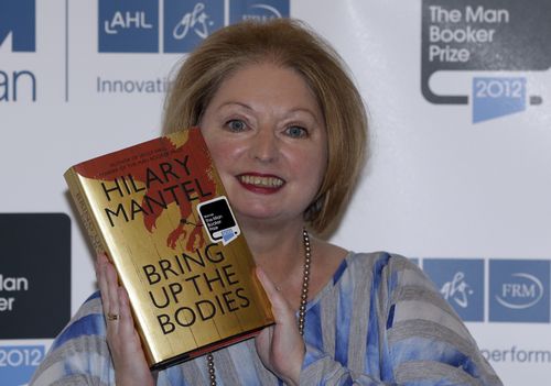 Hilary Mantel, winner of the Man Booker Prize for Fiction, poses with a copy of her book 'Bring up the Bodies', shortly after the award ceremony in central London, on October 16, 2012. 