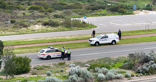 A police investigation is underway after a young man was found with serious injuries on a Perth highway.
