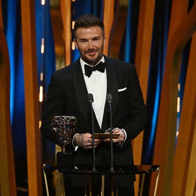 David Beckham presents the Outstanding Debut by a British Writer, Director or Producer on stage during the EE BAFTA Film Awards 2024.