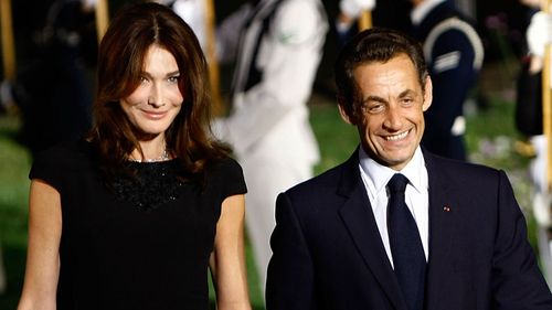 Nicolas Sarkozy (R) arrives with his wife Carla Bruni Sarkozy to the welcoming dinner for G-20 leaders