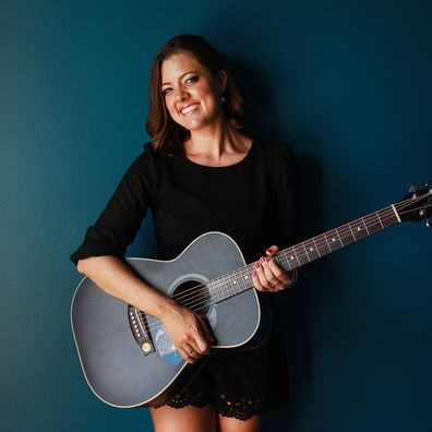 Amber Lawrence named Australian Country Music Female Artist of The Year poses at the Tamworth Entertainment Centre following her opening show with Kenny Rogers on January 25, 2015 in Tamworth, Australia.