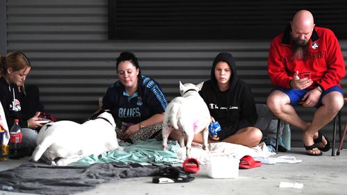 People take shelter at an evacuation centre in Ipswich. Parts of South-East Queensland are experiencing the worst flooding in over a decade.