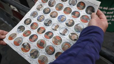 ROME, ITALY - MAY 06: An Irish priest holds an Irish newspaper displaying photos of Cardinals who could become the next Pope outside the Vatican before a College of Cardinals' meeting on May 06, 2025 in Rome, Italy. On May 7, 133 cardinals will enter the Sistine Chapel to begin the papal conclave, the secretive voting process that requires two-thirds majority to elect the new leader of the Catholic Church. The election follows the death of Pope Francis on April 21 at the age of 88. (Photo by Mar