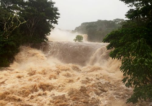 The flooded Wailuku River near Hilo, Hawaii, after the hurricane made landfall.