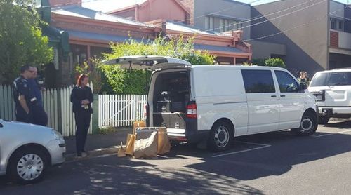 Bags of evidence were loaded into a police van. (9NEWS)
