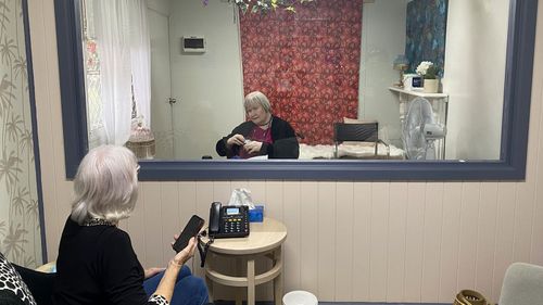 Sister Eileen Hardman and Trish Yelland have been catching up like this until they are allowed to hug again.