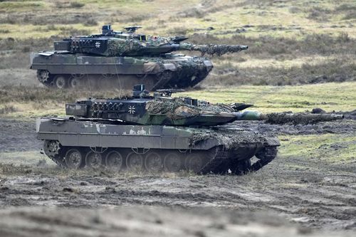 Two Leopard 2 tanks are seen in action during a visit of German Defense Minister Boris Pistorius at the Bundeswehr tank battalion 203 at the Field Marshal Rommel Barracks in Augustdorf, Germany, Feb. 1, 2023.