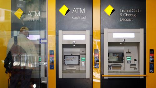 A man uses a Commonwealth Bank of Australia ATM in Sydney, Australia, April 19, 2018.