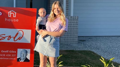 Erica Newman, pictured with her one-year-old son outside their new home.