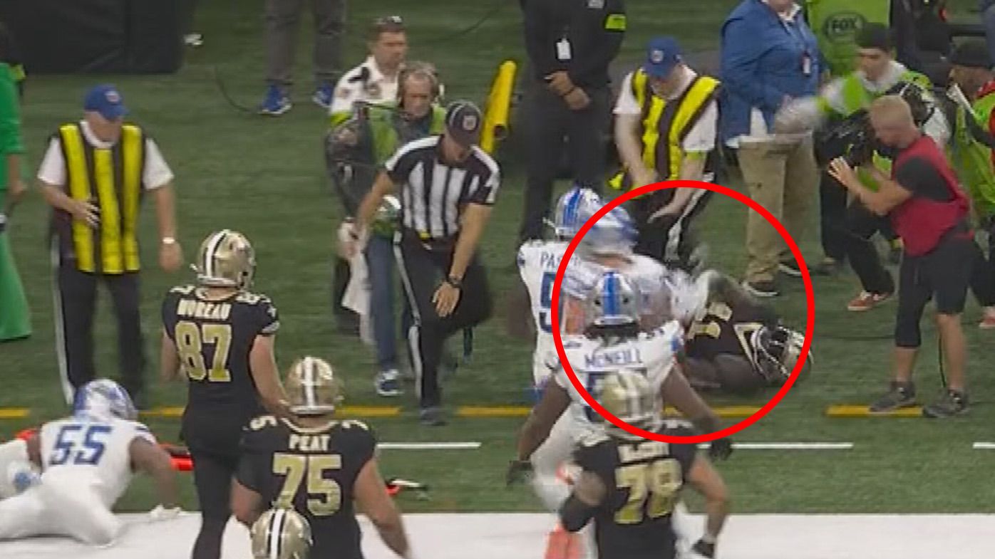 An NFL sideline official was stretched from the field after suffering a brutal broken leg in this collision with New Orleans Saints plater Alvin Kamara.