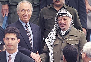 Yasser Arafat won the Nobel Peace Prize with Shimon Peres and which other leader?