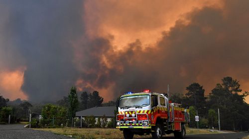 Rural Fire Service (RFS) crews prepare for the Green Wattle Creek Fire as it threatens homes in Yandeera in the south west of Sydney, Saturday, December 21, 2019. Temperatures in the 40's and high north westerly winds under extreme fire conditions are fanning a a number of fires around Sydney