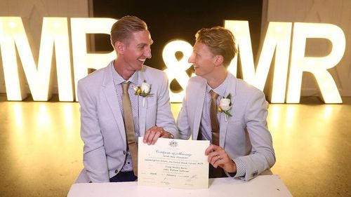 Craig Burns (left) and Luke Sullivan tied the knot just after the stroke of midnight. (9NEWS)
