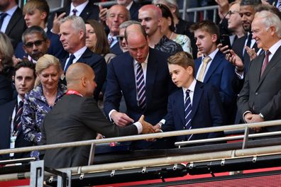 LONDON, ENGLAND - MAY 25: Prince George of Wales, shakes hands with Pep Guardiola, Manager of Manchester City, after the Emirates FA Cup Final match between Manchester City and Manchester United at Wembley Stadium on May 25, 2024 in London, England. (Photo by Mike Hewitt/Getty Images)