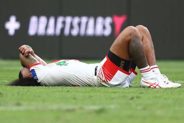 Moses Suli lays on the field. 
