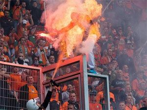 A Polish football fan is engulfed by flames. (supplied)