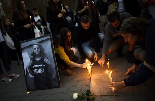 People attend a vigil as a protest against the rape murder of journalist Viktoria Marinova in Sofia, Bulgaria