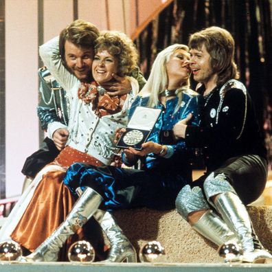 ABBA band members on stage after winning Eurovision in 1974.