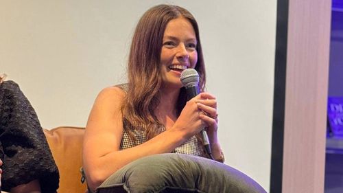 Stacey McEwan speaks at a book event in Australia.